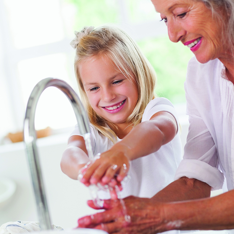 Little Girl Washing Hands With Granny Energlaze