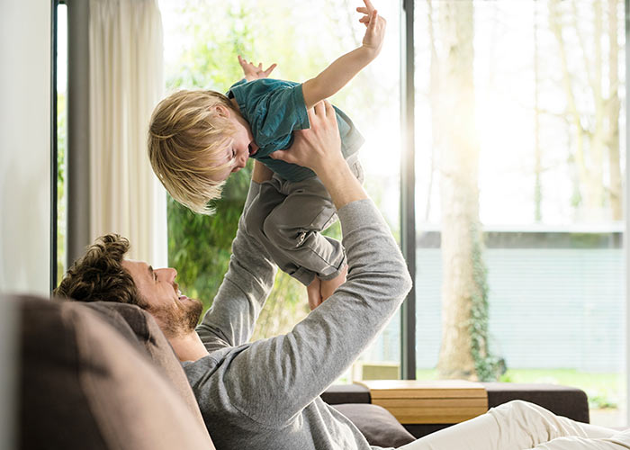 Father and son in front of new window