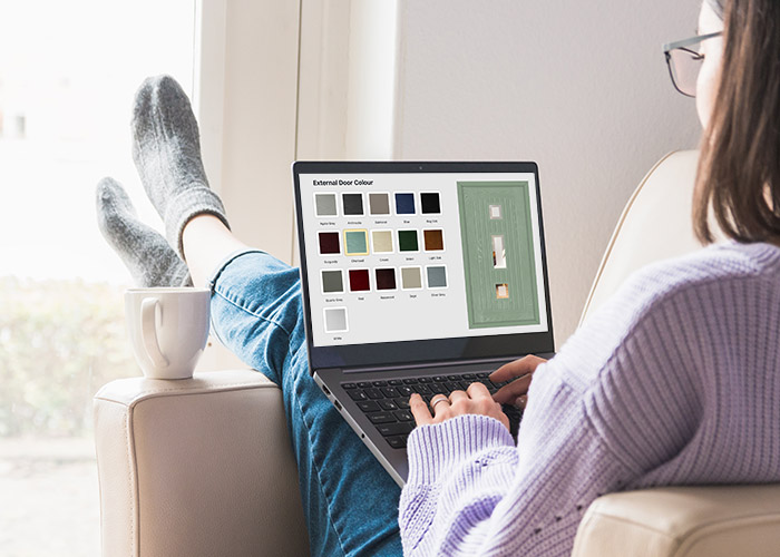 Woman on laptop designing door