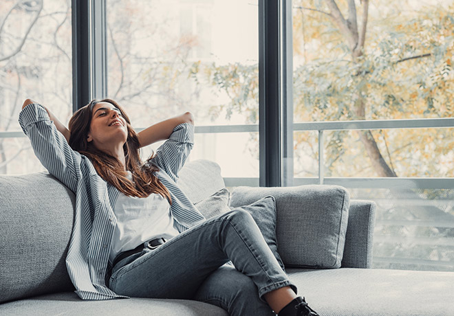 Woman relaxing in cosy home