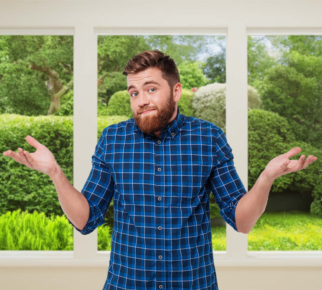 Man at window looking confused