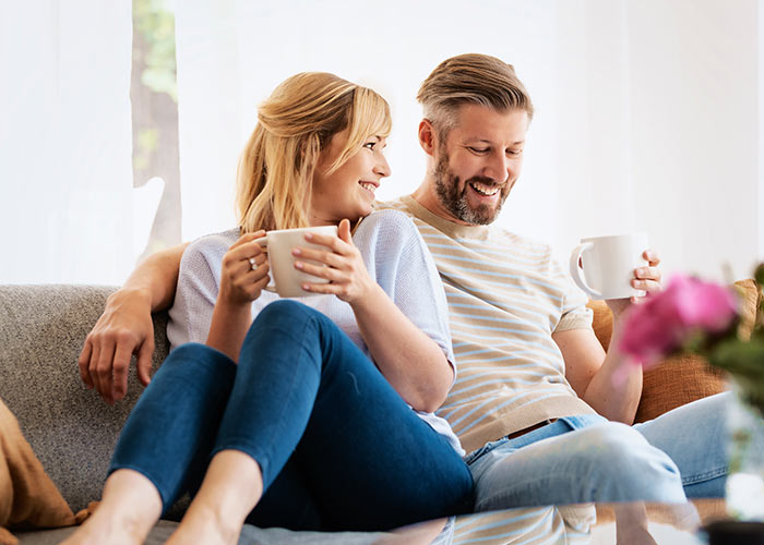 Happy couple on sofa